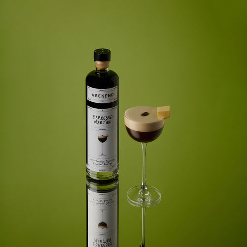 Pre-mixed espresso martini cocktail in a bottle and glass