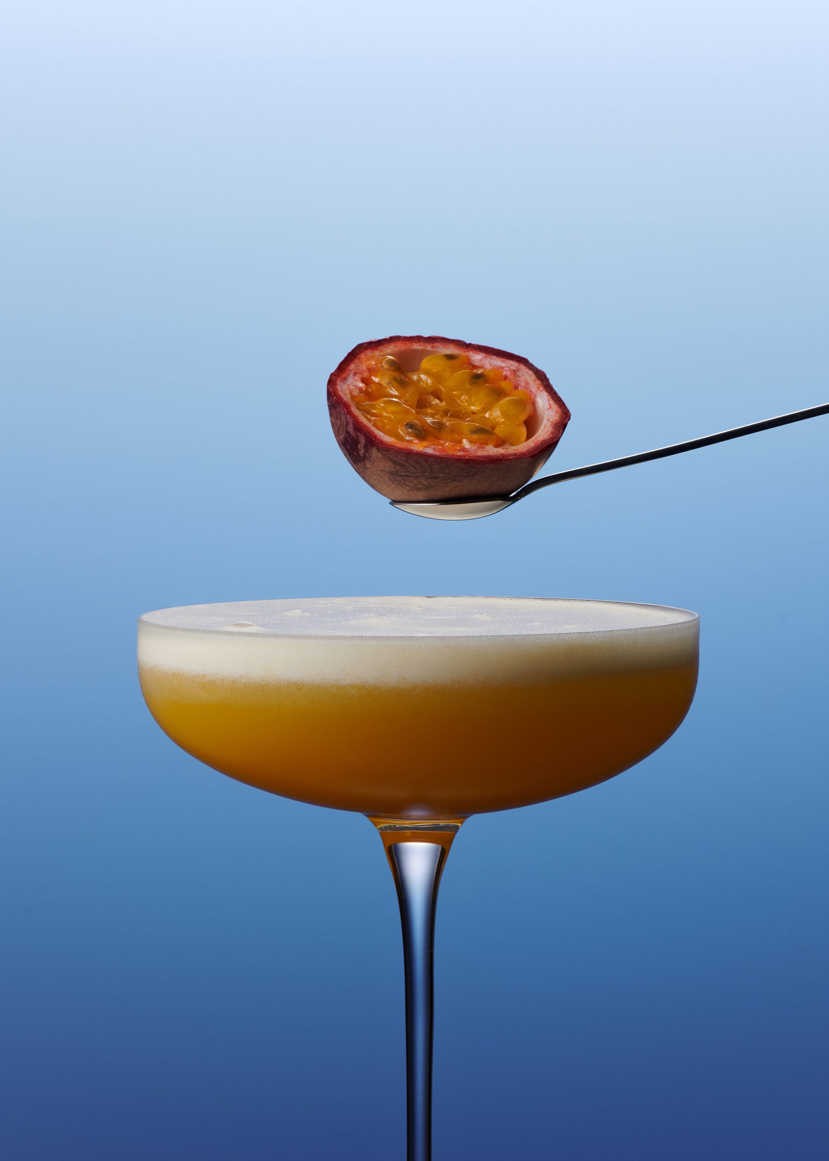 Pornstar Martini visual with passion fruit and spoon